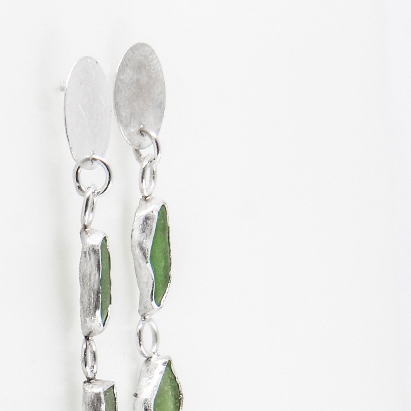 long green dangling sea glass earrings with textured 925 sterling silver disc