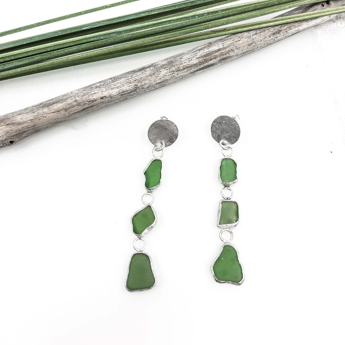 long green dangling sea glass earrings with textured 925 sterling silver disc