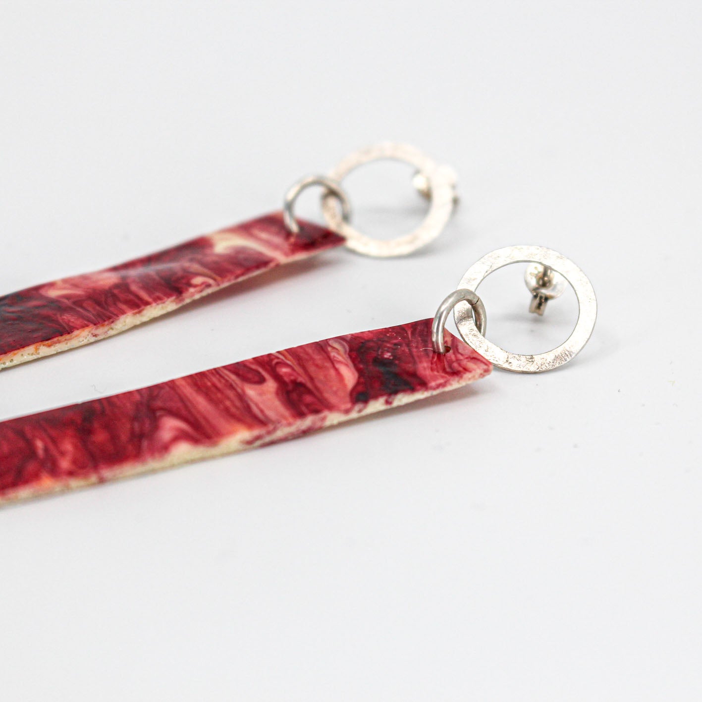 long dangling earrings • hammered sterling silver circle • red marbled resin element