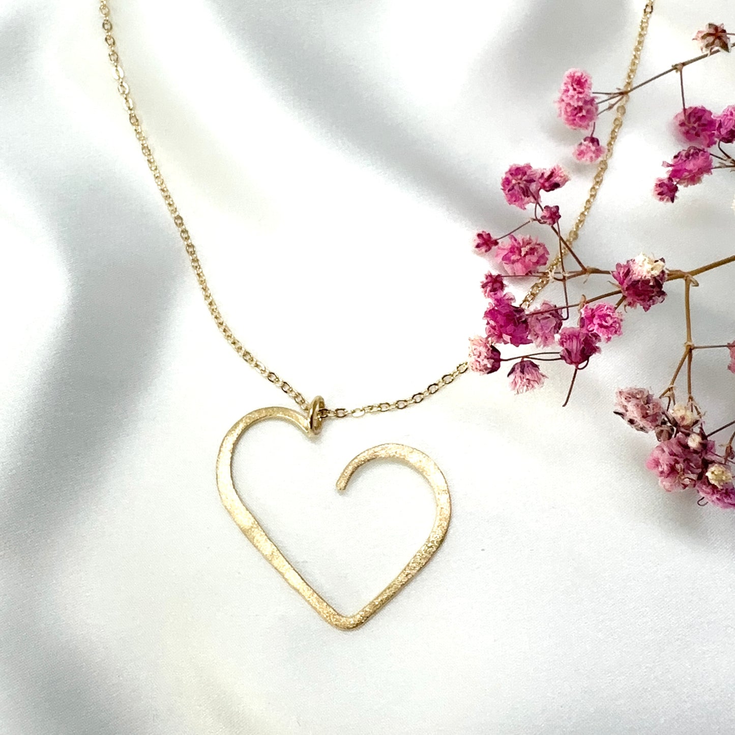 set of gold plated minimalist heart pendant necklace and matching stud earrings