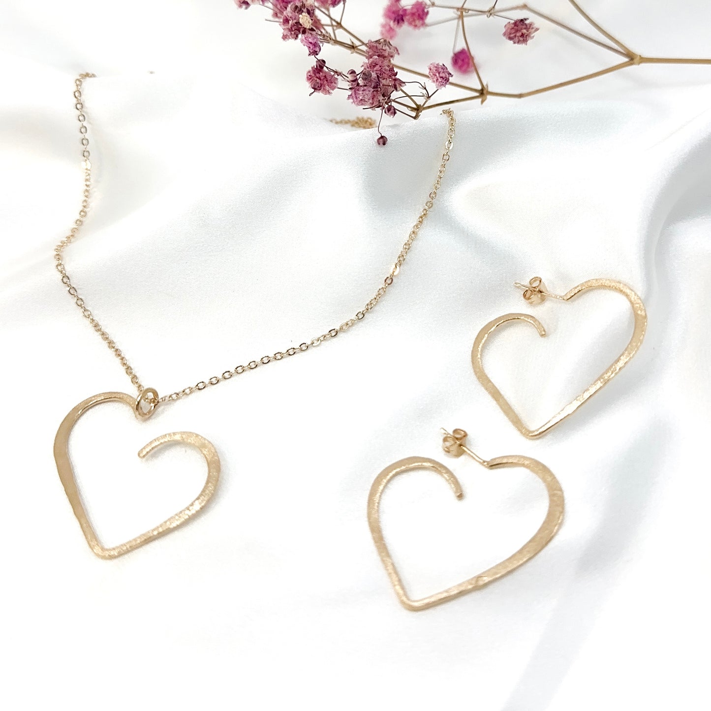 set of gold plated minimalist heart pendant necklace and matching stud earrings