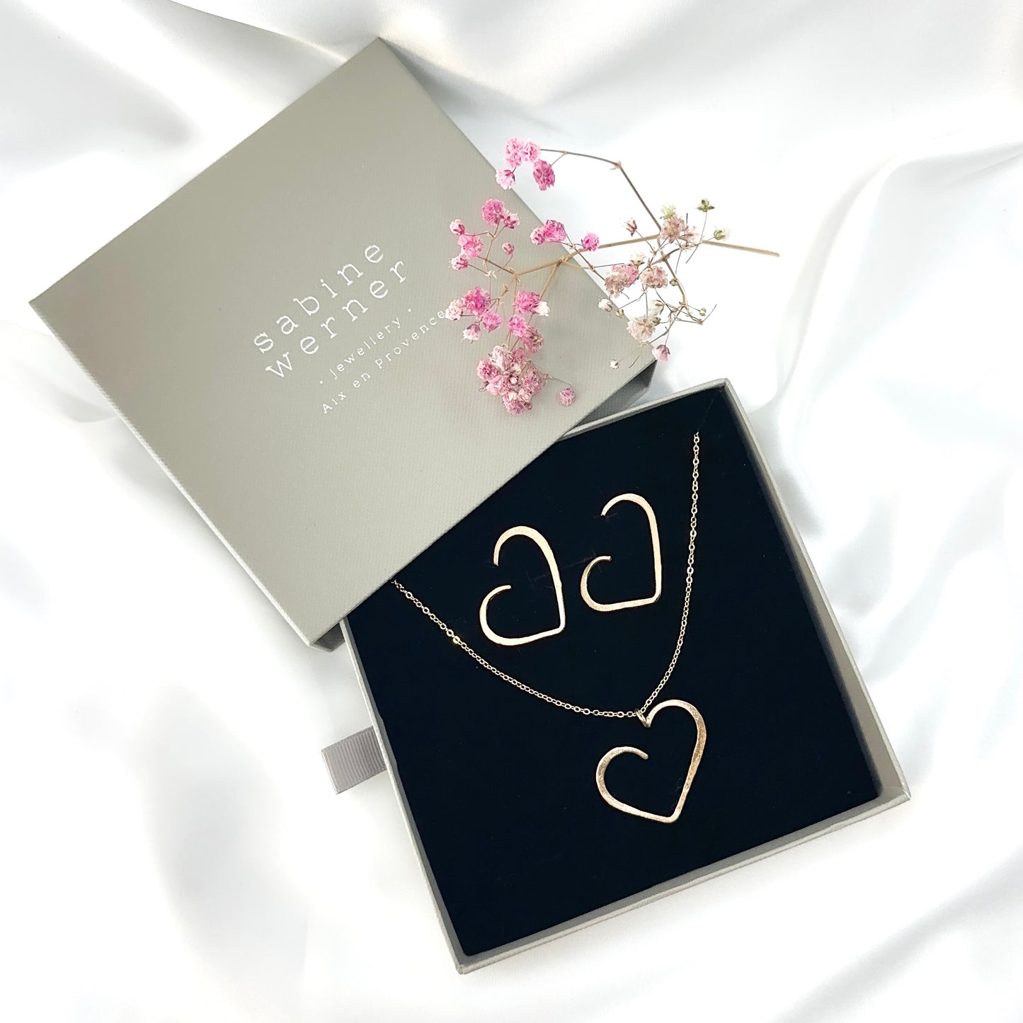 set of gold plated minimalist heart pendant necklace and matching stud earrings