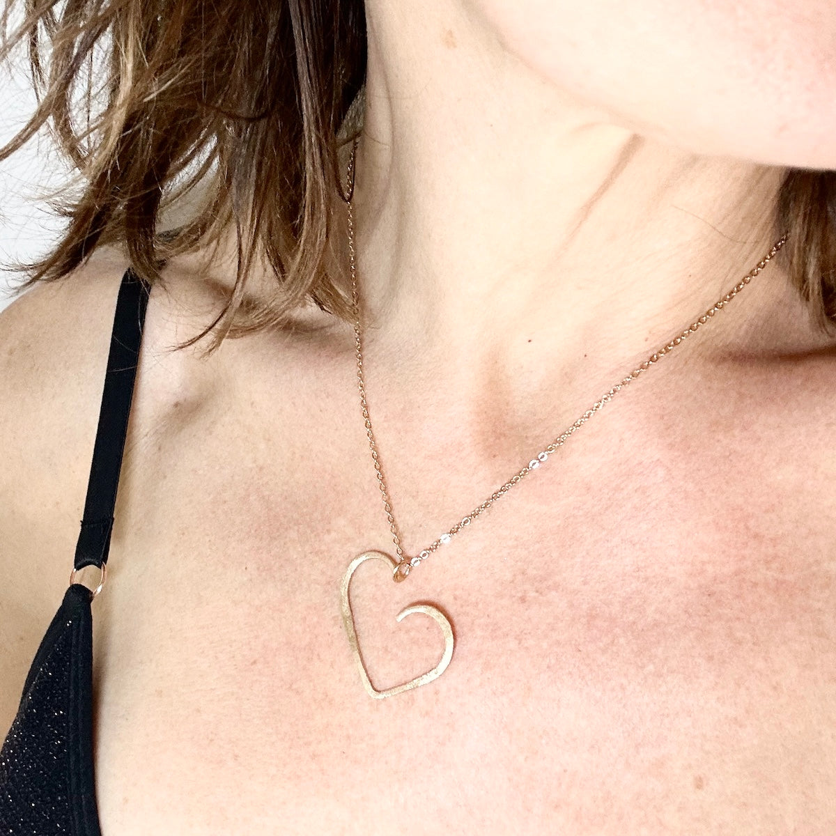 set of gold plated minimalist heart pendant necklace and matching stud earrings