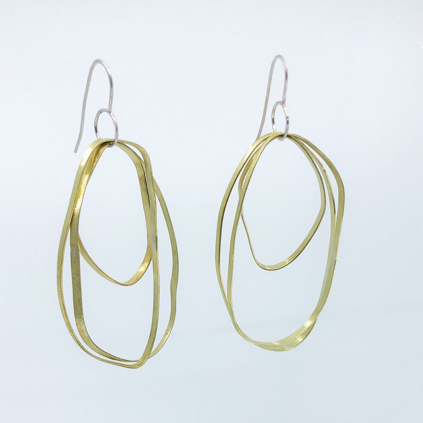 long dangling brass earrings with sterling silver hook • three textured free form elements