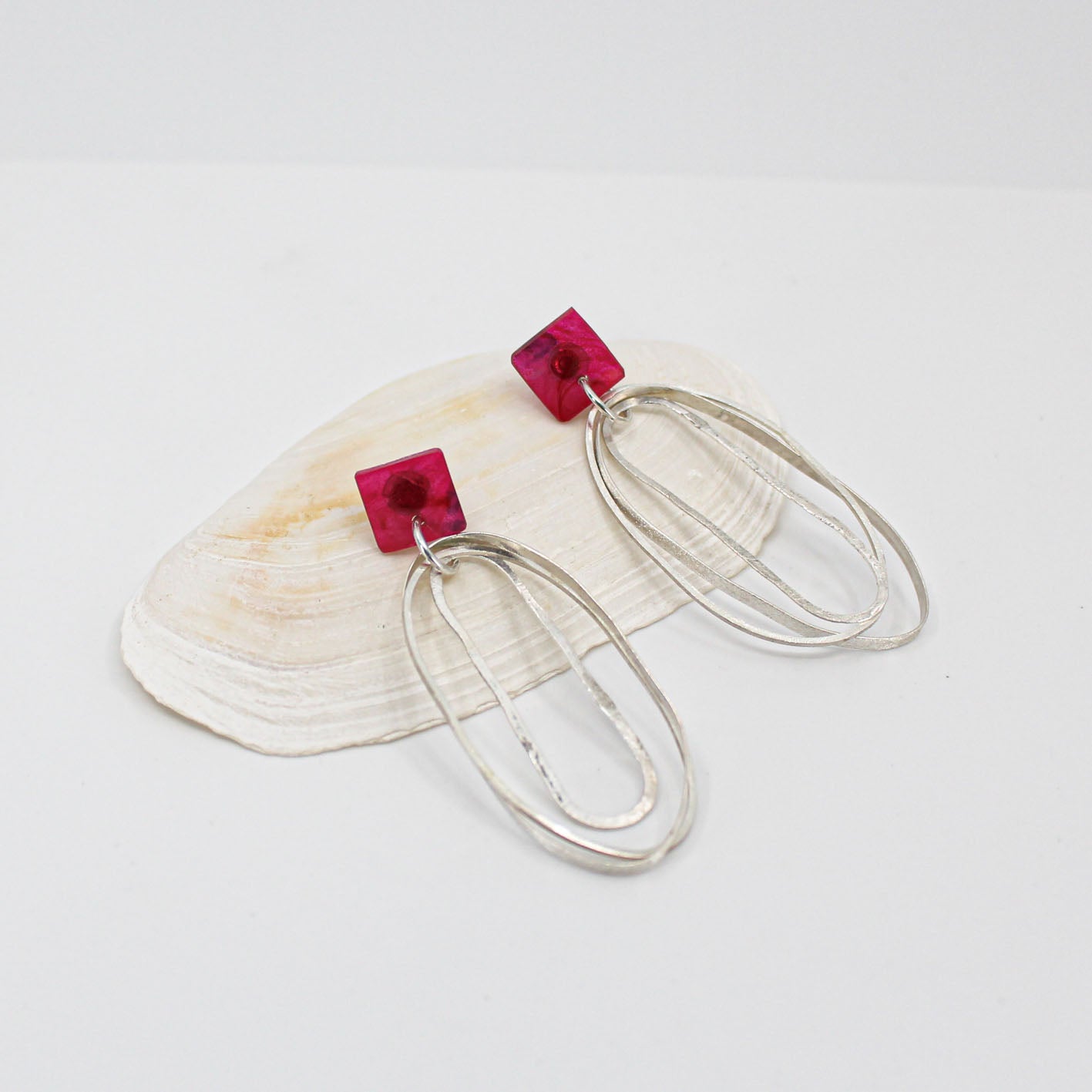 long oval dangly silver earrings with pink resin square top