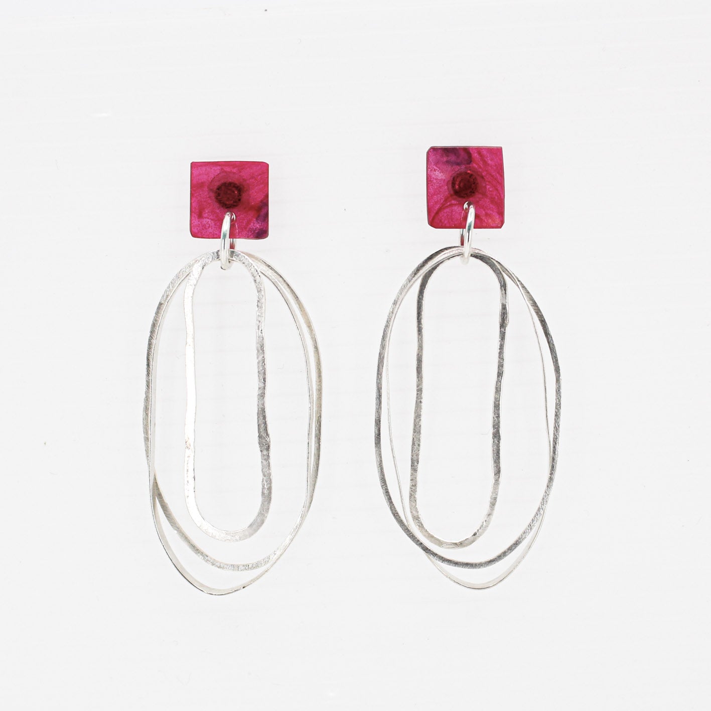 long oval dangly silver earrings with pink resin square top
