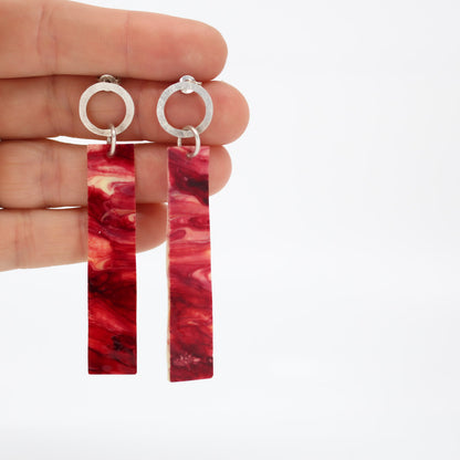 long dangling earrings • hammered sterling silver circle • red marbled resin element