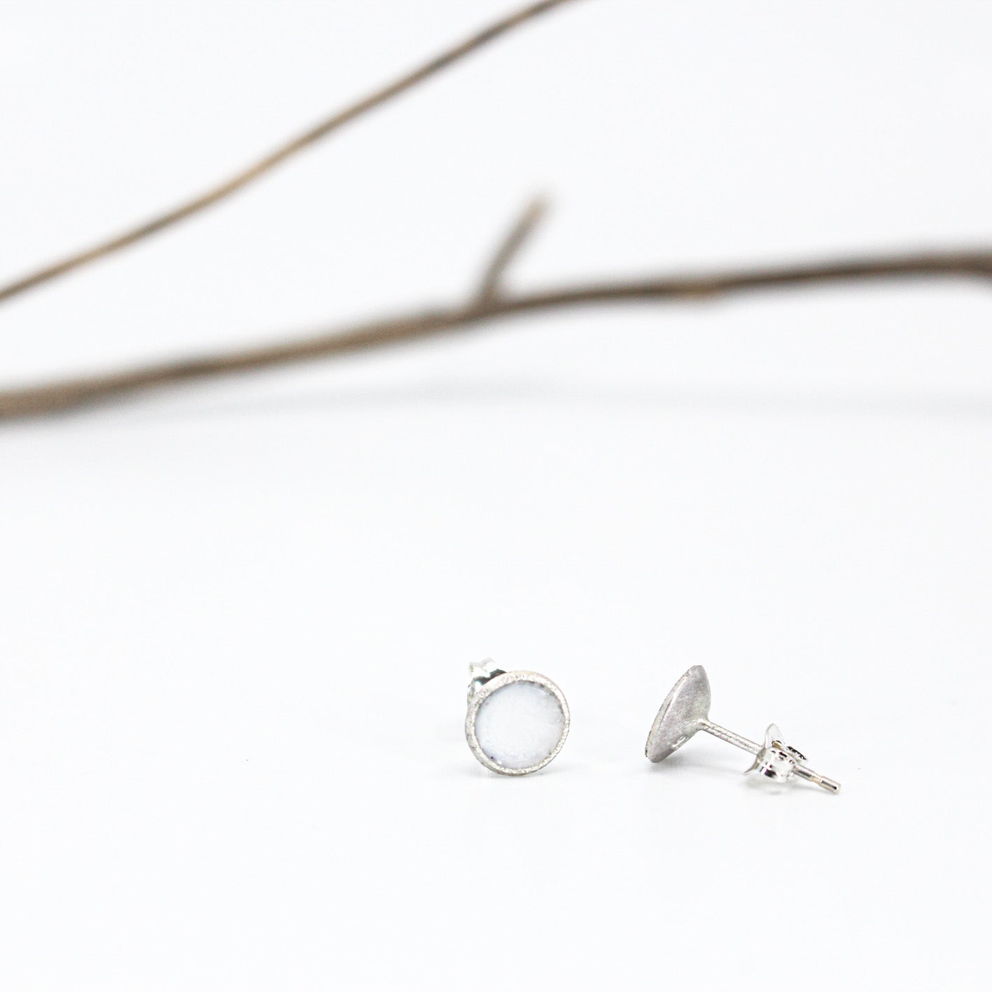 small minimalist round sterling silver stud earrings with white or grey or black resin