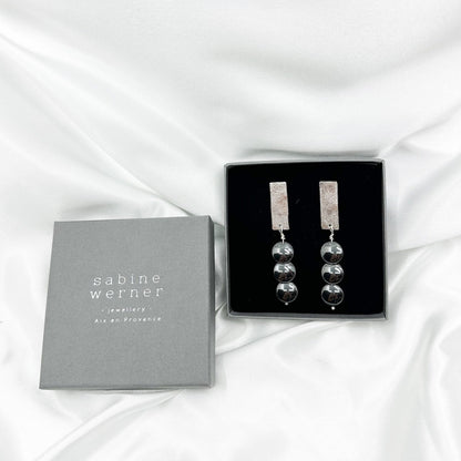 Handmade sterling silver hematite drop earrings with minimalist sculptural design.boxed