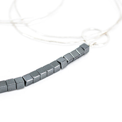extra long minimalist statement necklace with hematite cubes and sterling silver rings