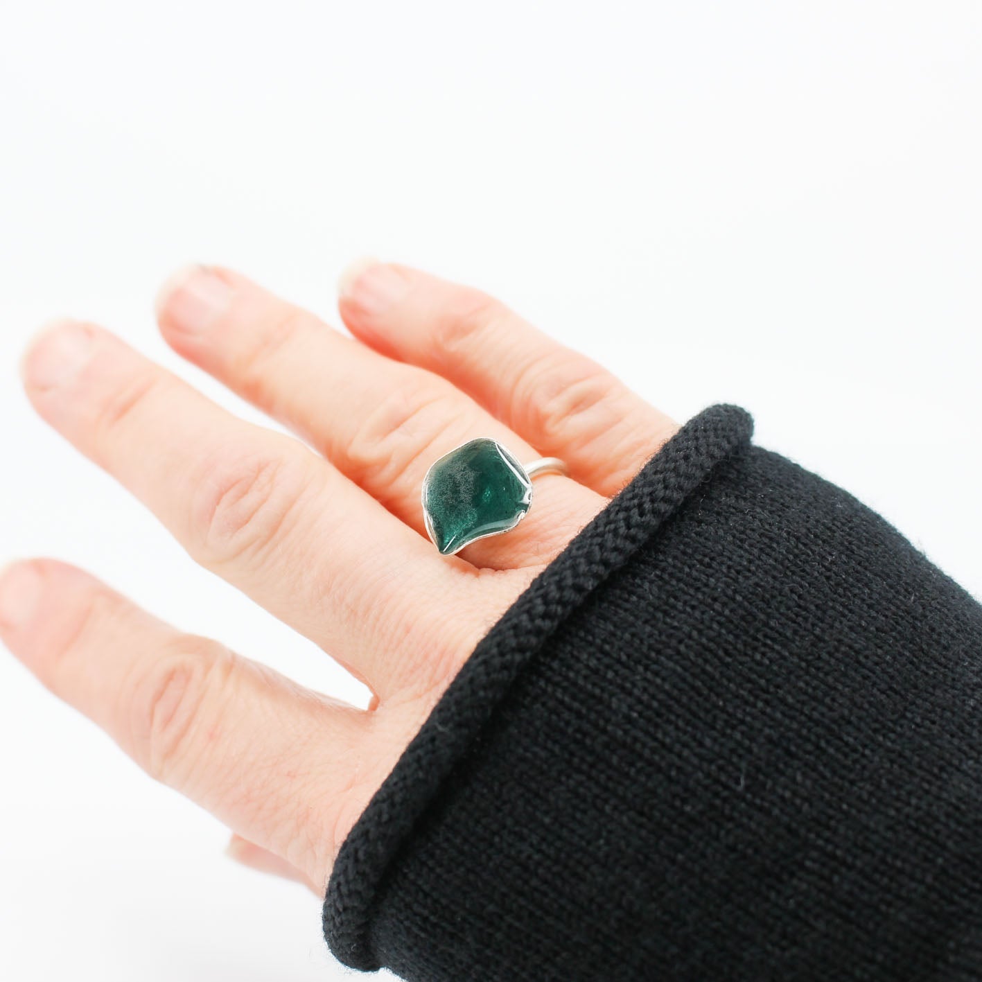 silver statement ring coated with teal blue resin