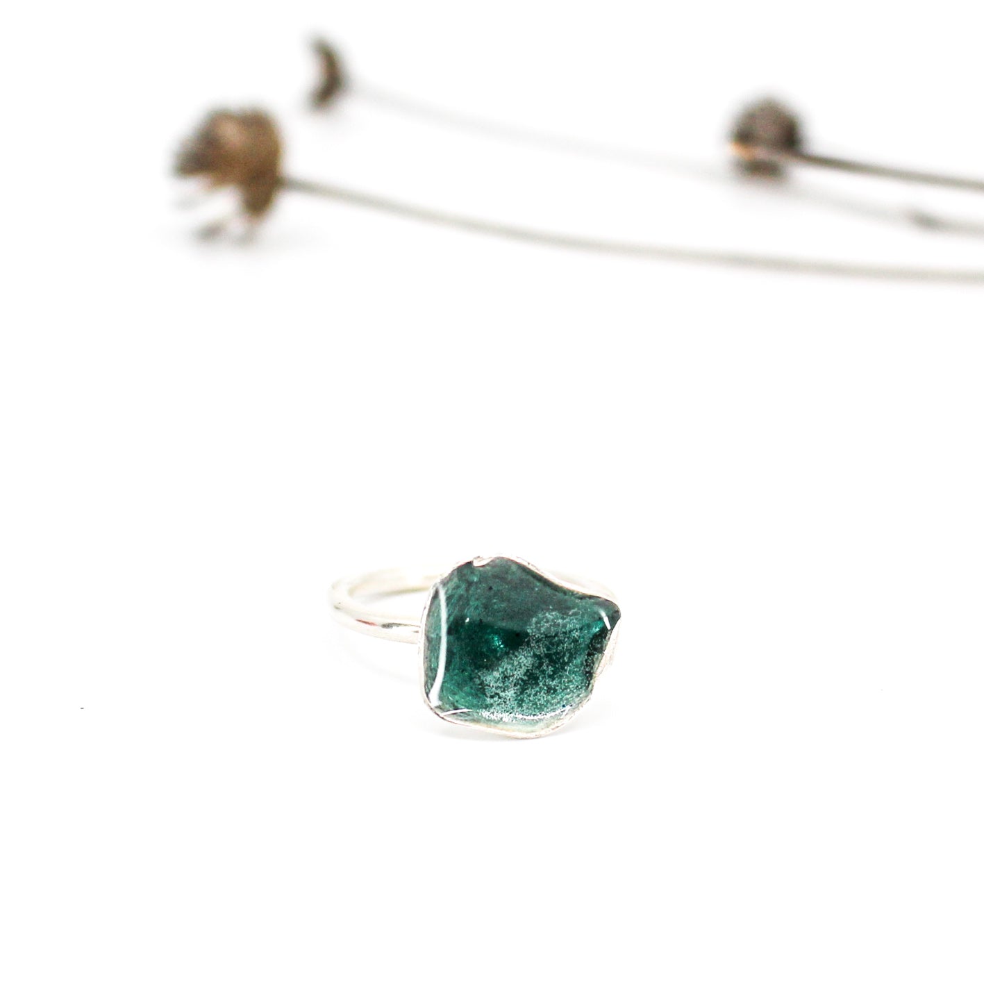 silver statement ring coated with teal blue resin