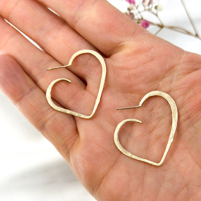set of gold plated minimalist heart pendant necklace and matching stud earrings