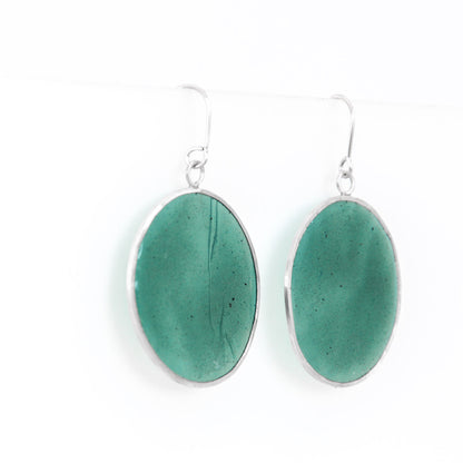green dangling resin earrings in sterling silver