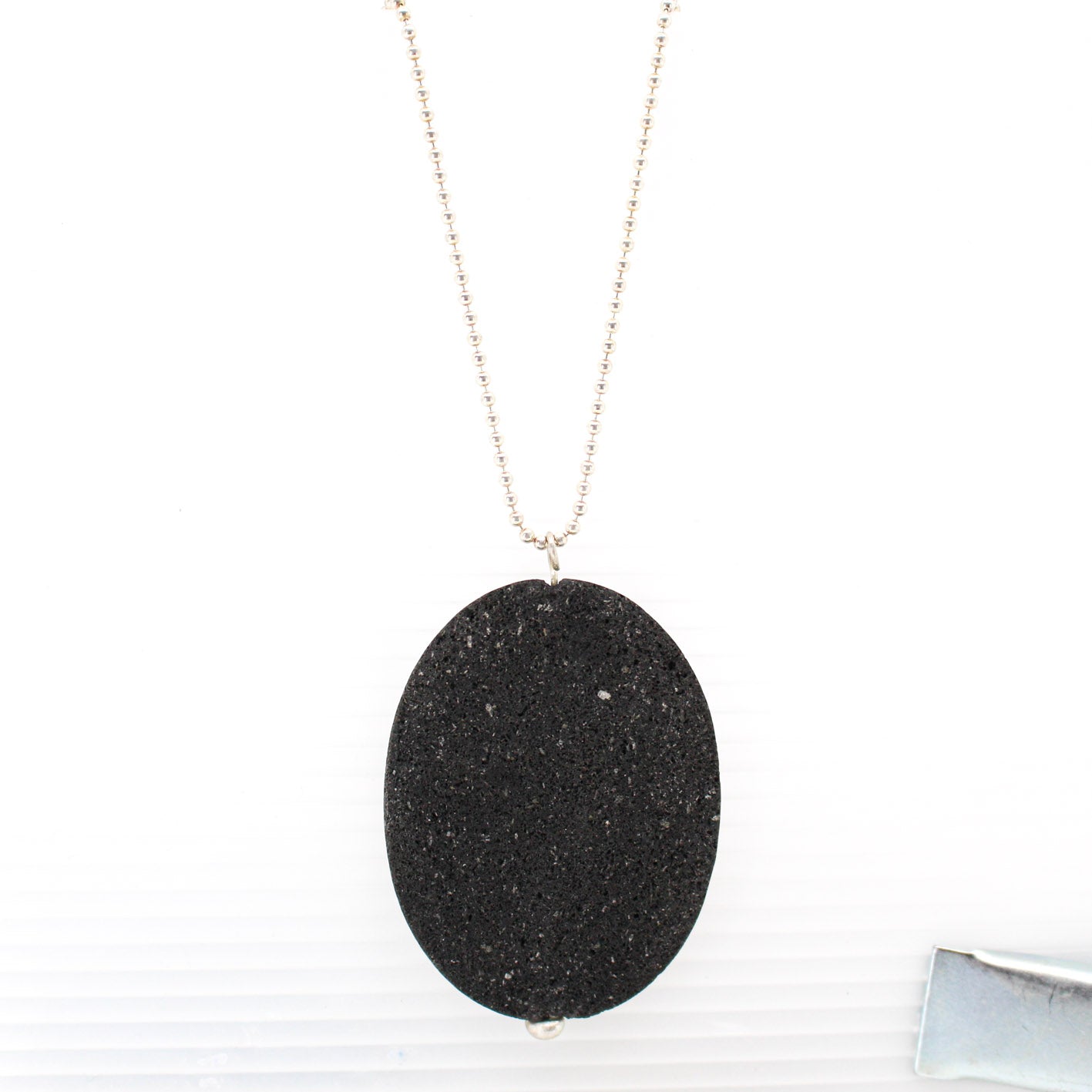 big lava stone pendant on long sterling silver ball chain